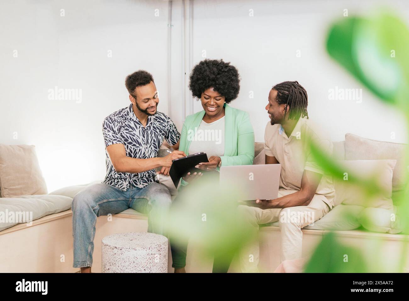 Diverse team collaborating on a project in a coworking space Stock Photo