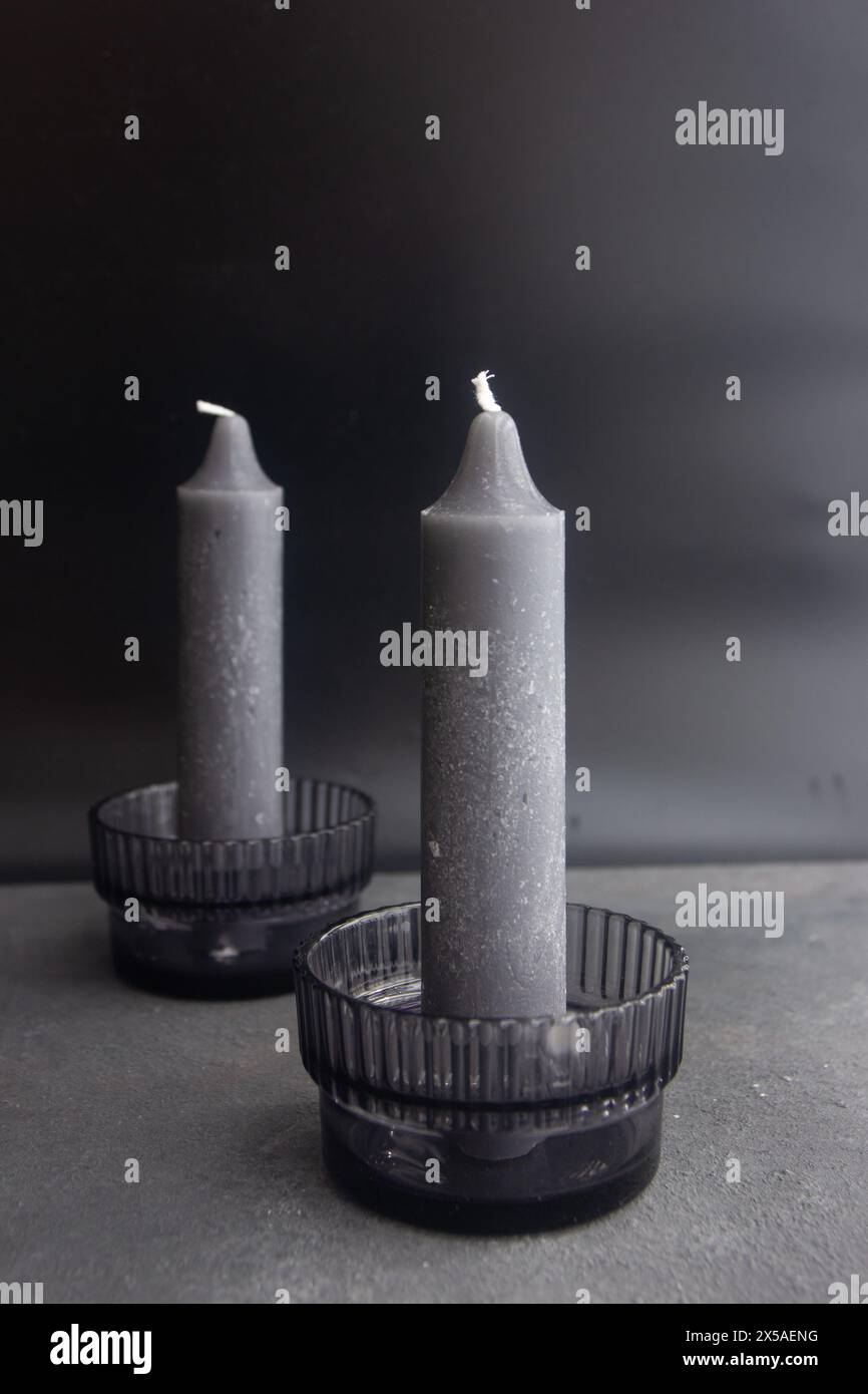 two black color candle holder with black candles, dark and moody effect