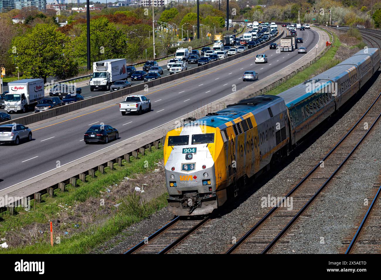 Gardiner Expressway and Via Rail rail traffic during rush hour traffic. Toronto Ontario Canada Stock Photo
