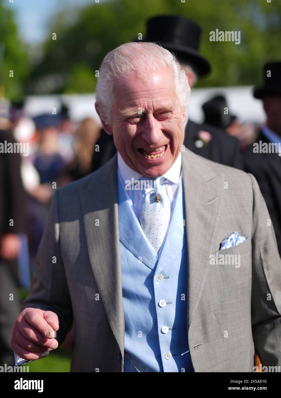 King Charles III speaks to guests attending a Royal Garden Party at Buckingham Palace, London. Picture date: Wednesday May 8, 2024. Stock Photo