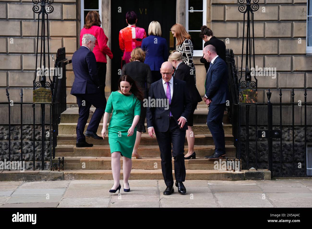 RETRANSMITTED CORRECTING NAME FROM HISLOP to HYSLOP Newly appointed Cabinet members, including Angus Robertson, Fiona Hyslop, Angela Constance, Jenny Gilruth, Shirley-Anne Somerville and Mairi Gougeon, Mairi McAllan, Shona Robison and Neil Gray, turn to enter Bute House in Edinburgh as newly appointed First Minister of Scotland John Swinney and Kate Forbes who he appointed as Deputy First Minister, walk to address the media. Picture date: Wednesday May 8, 2024. Stock Photo