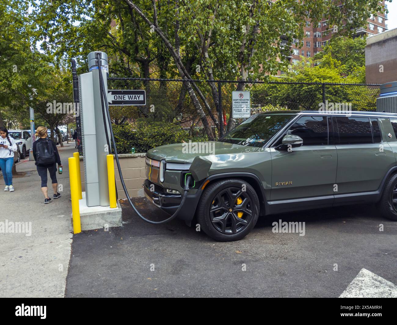 A Rivian R1S charging at a Chargepoint electric vehicle charging station in Chelsea in New York