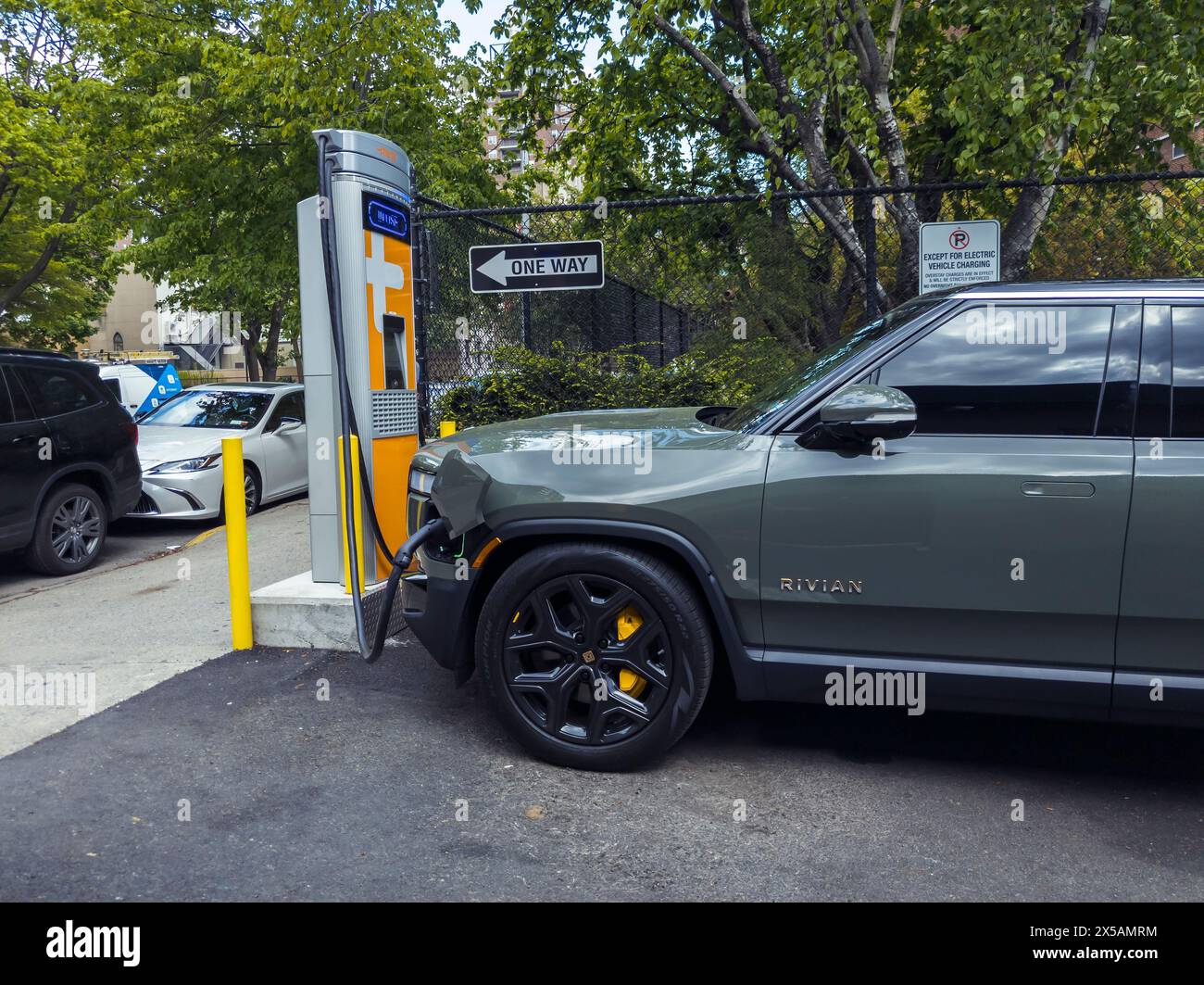 A Rivian R1S charging at a Chargepoint electric vehicle charging station in Chelsea in New York