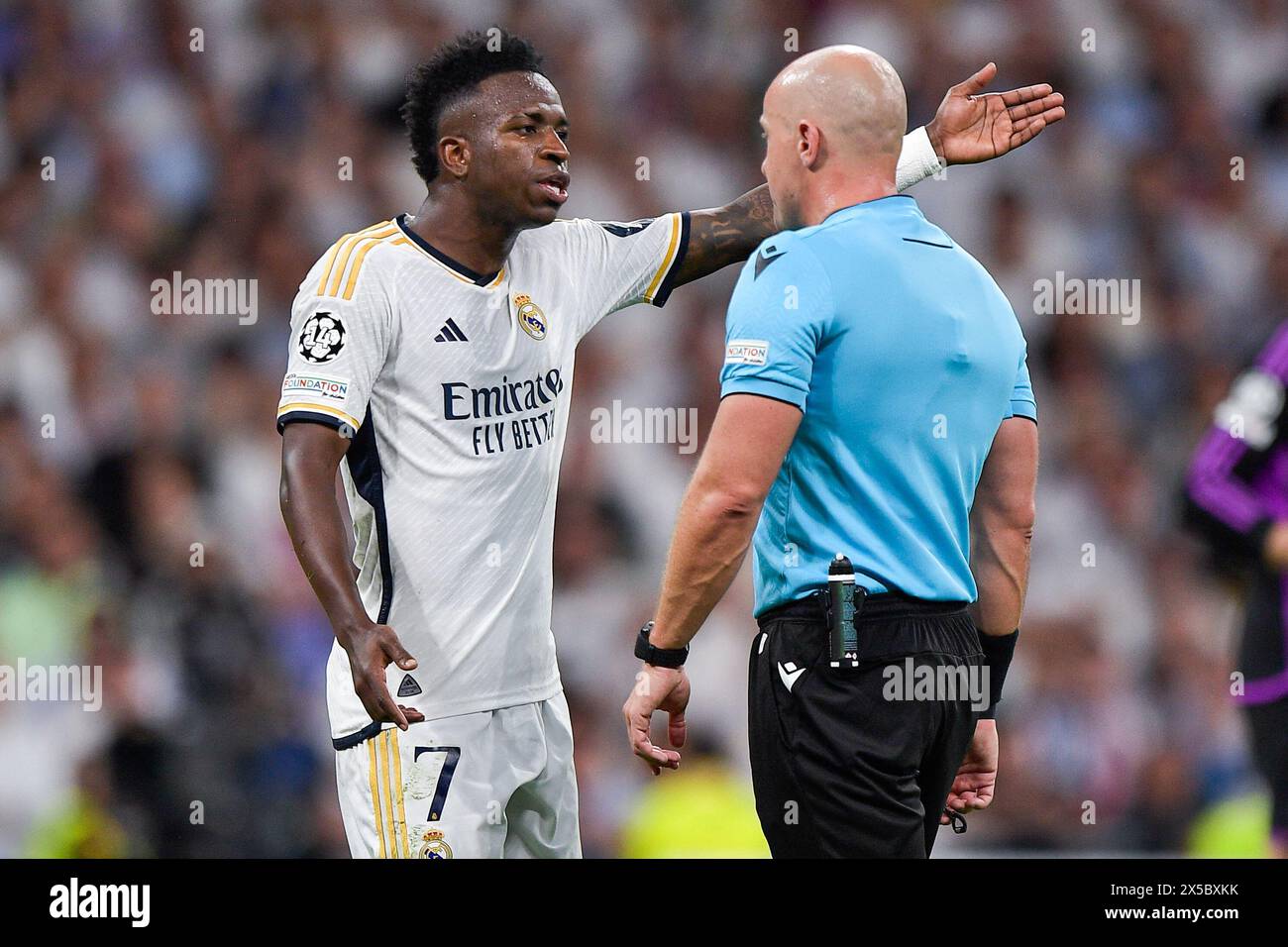 Madrid, Spain. 08th May, 2024. MADRID, SPAIN - MAY 8: Vinicius Junior of Real Madrid interacts with referee Szymon Marciniak during the Semi-final Second Leg - UEFA Champions League 2023/24 match between Real Madrid and FC Bayern Munchen at Estadio Santiago Bernabeu on May 8, 2024 in Madrid, Spain. (Photo by Pablo Morano/BSR Agency) Credit: BSR Agency/Alamy Live News Stock Photo