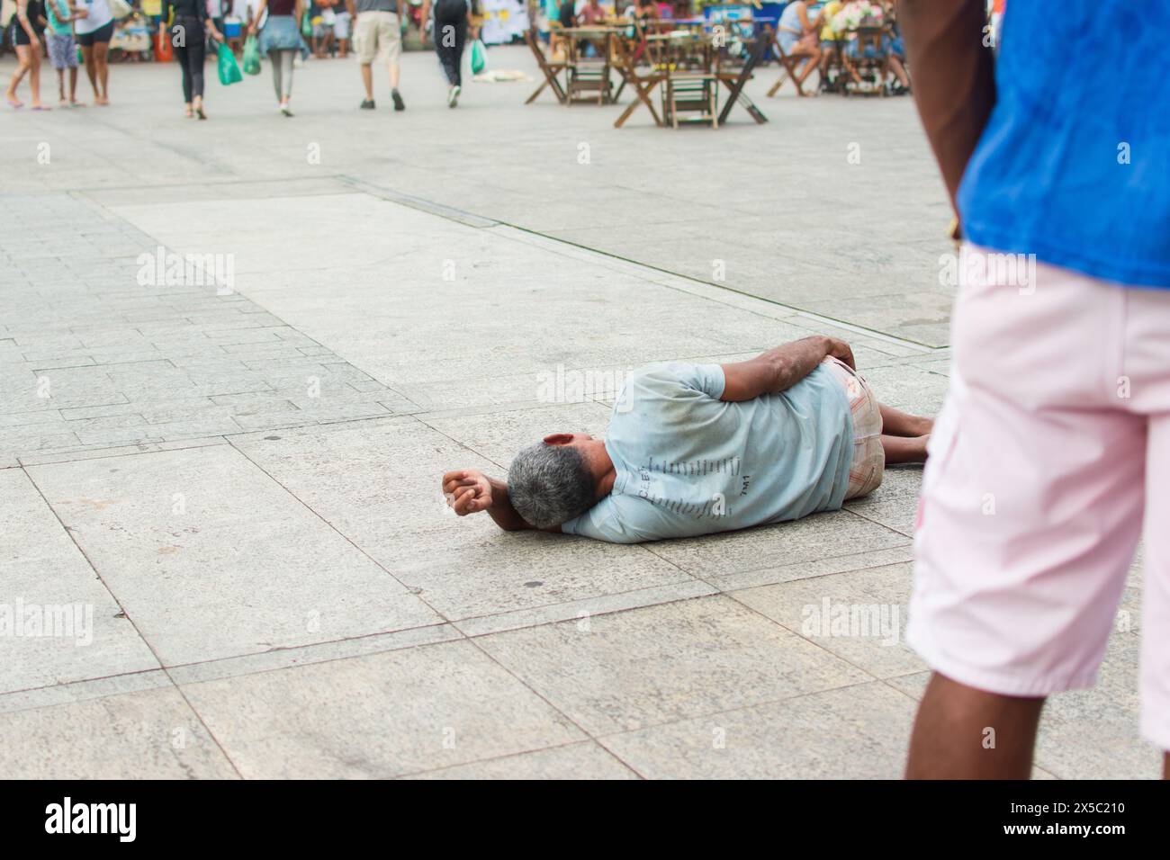 Salvador, Bahia, Brazil - July 27, 2019: A homeless man is seen sleeping in Praça da Se in Pelourinho, the historic center of the city of Salvador, Ba Stock Photo