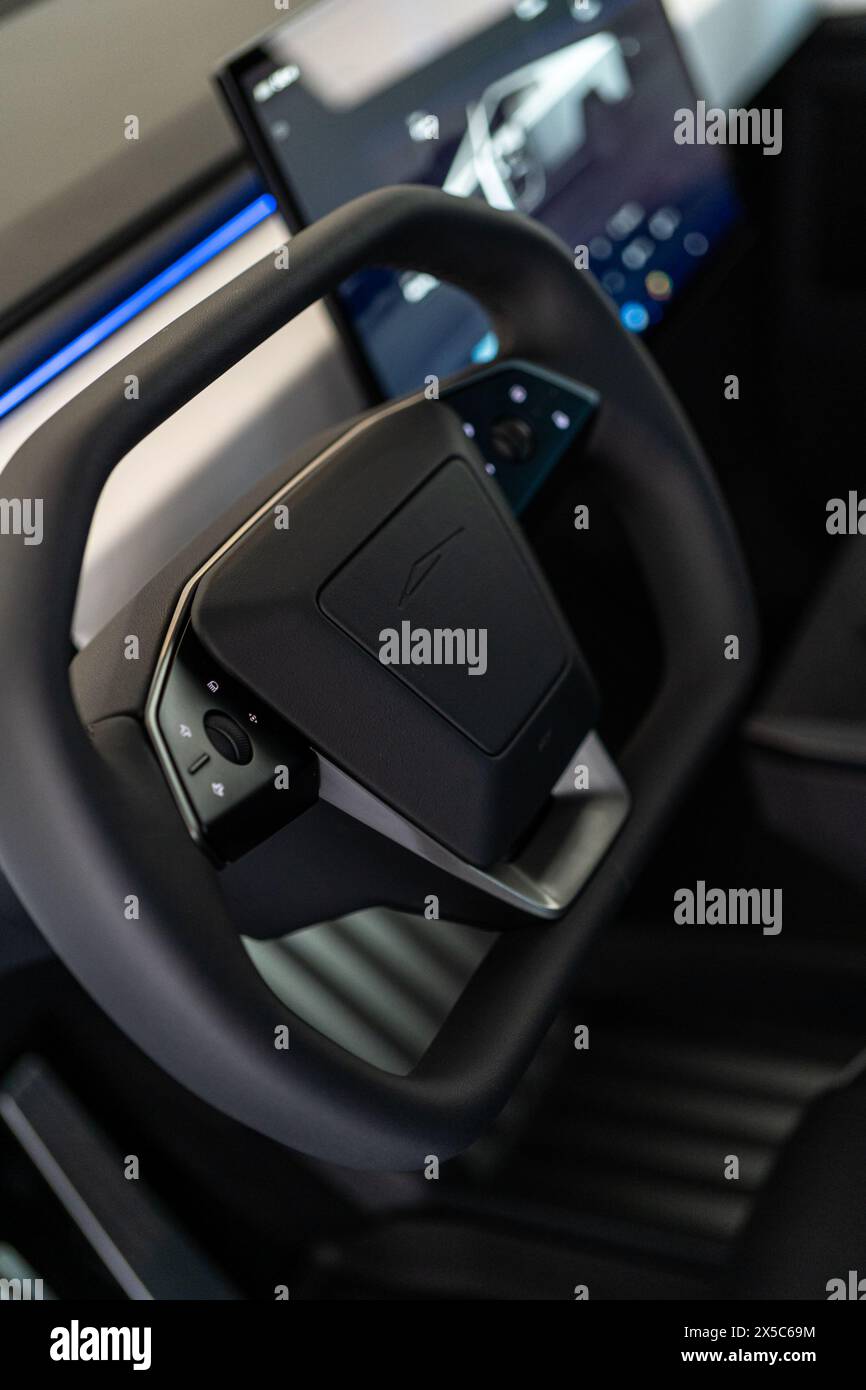 Interior View of Tesla Cybertruck Steering Wheel and Controls Stock