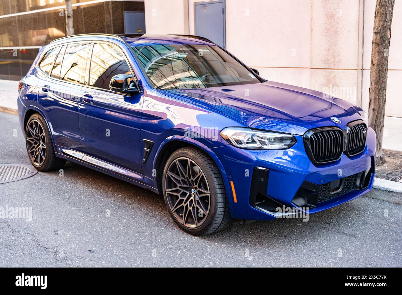 New York City, USA - March 25, 2024: BMW X3 M vibrant blue color car ...