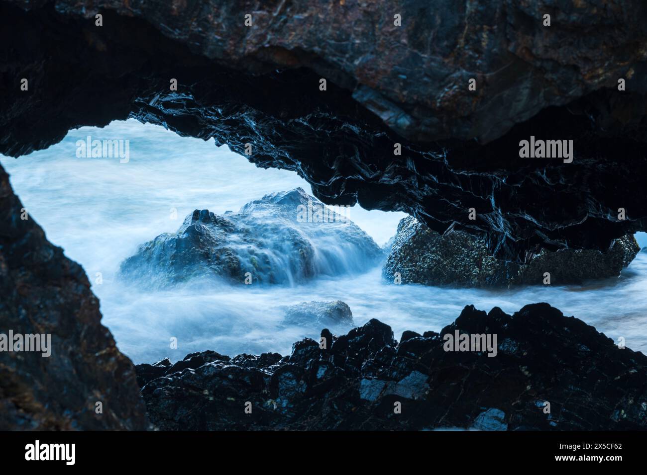 Ocean's Untamed Power Through Nature's Window Stock Photo - Alamy