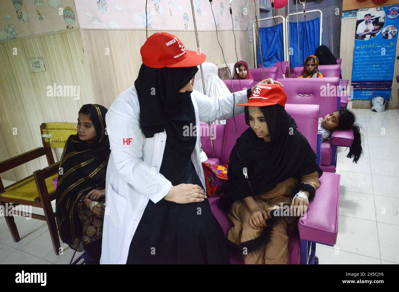 May 8, 2024, Peshawar, Peshawar, Pakistan: World Thalassemia Day in Peshawar.PESHAWAR, PAKISTAN, MAY, 08: Pakistani children suffering from the blood disorder thalassemia receive blood transfusion at a Hamza Foundation Medical Center, on the eve of the World Thalassemia Day, in Peshawar, Pakistan, 08 May 2024. Thalassemia is an inherited blood disorder that affects the body's ability to produce hemoglobin and healthy red blood cells. World Thalassemia Day is marked annually on 08 May. The theme of World Thalassemia Day 2024 is 'Empowering Lives, Embracing Progress: Equitable and Accessible Th Stock Photo