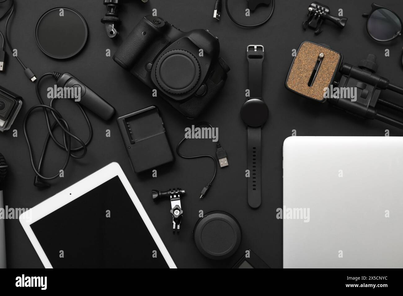 Composition with different modern gadgets on dark background Stock Photo