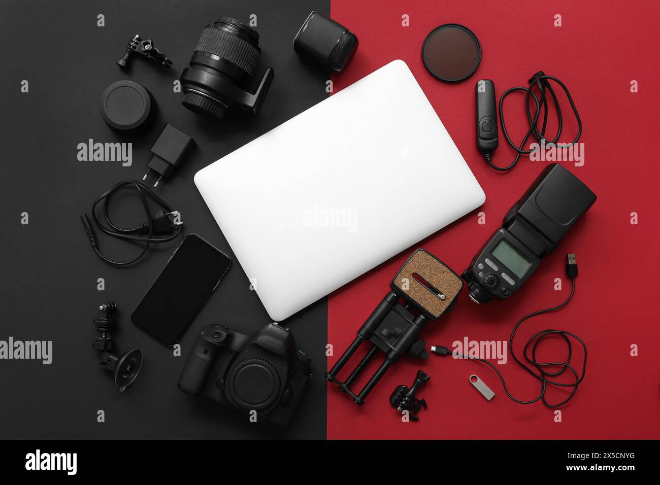 Composition with different gadgets and modern laptop on dark background Stock Photo