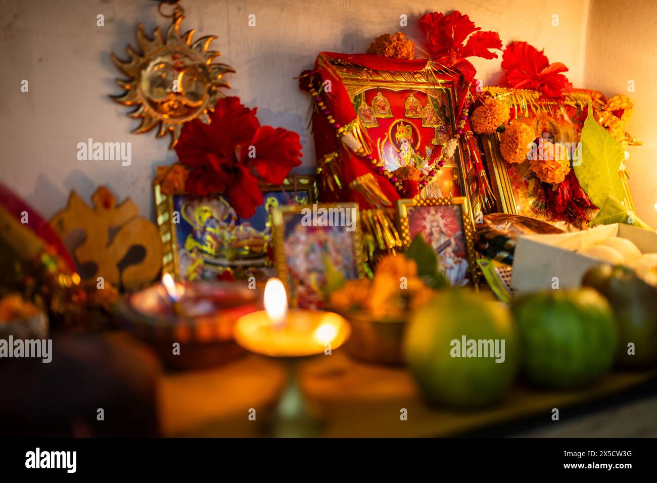 holy hindu god worship with flowers at durga pooja festival at night from different angle Stock Photo