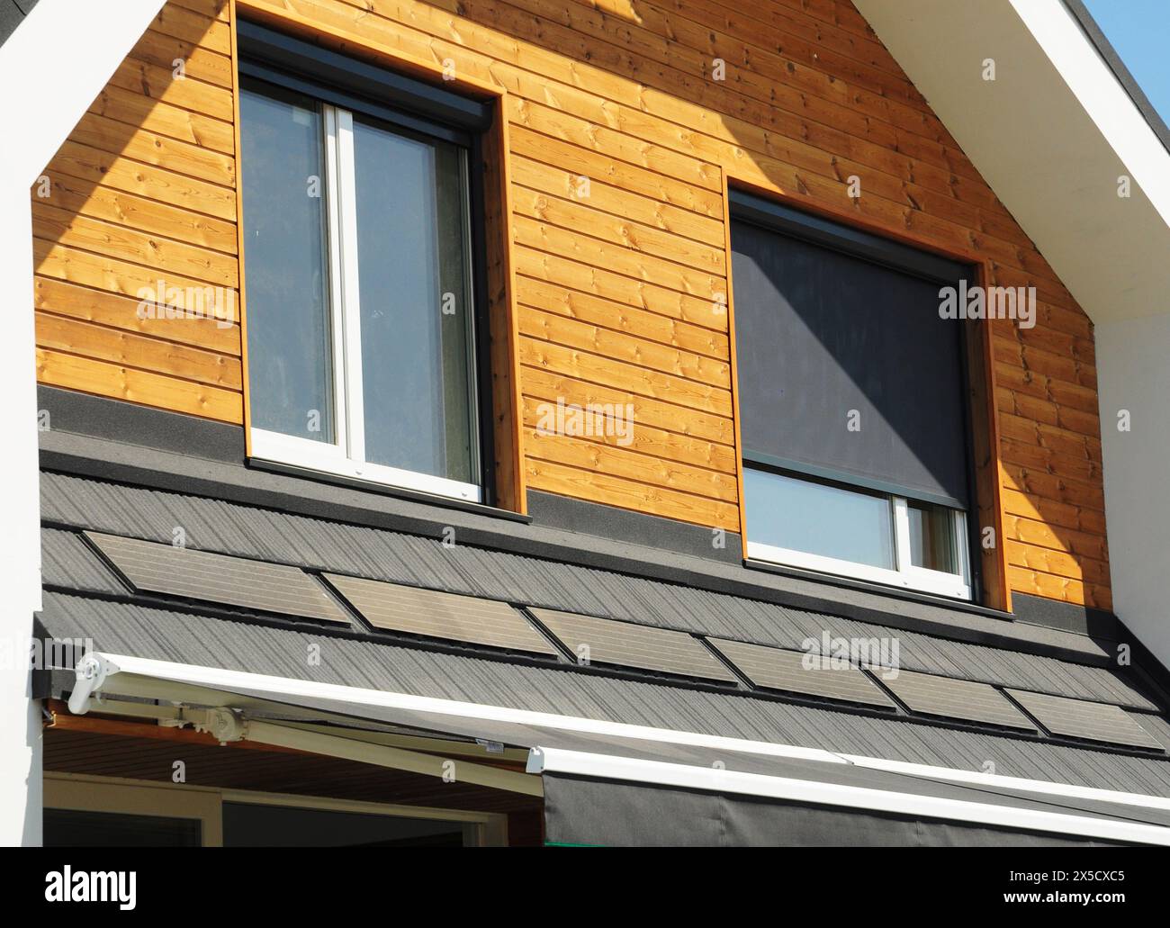 Retractable Sun Shades and Solar Screens on attic windows. Retractable