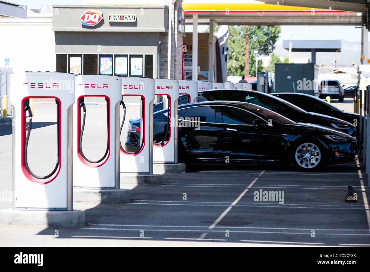 A large collection of Tesla Superchargers in action along Interstate 15