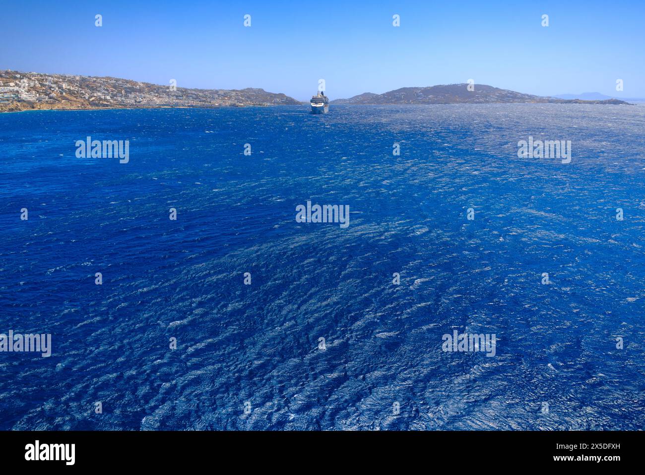 Mykonos Island skyline with cruise ship, Greece. Stock Photo