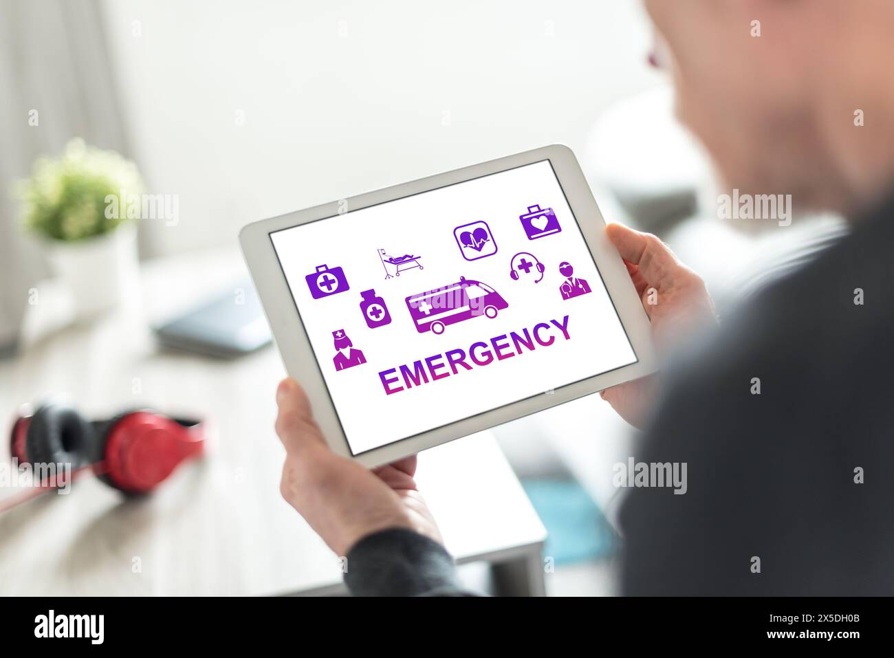 Tablet screen displaying an emergency concept Stock Photo - Alamy