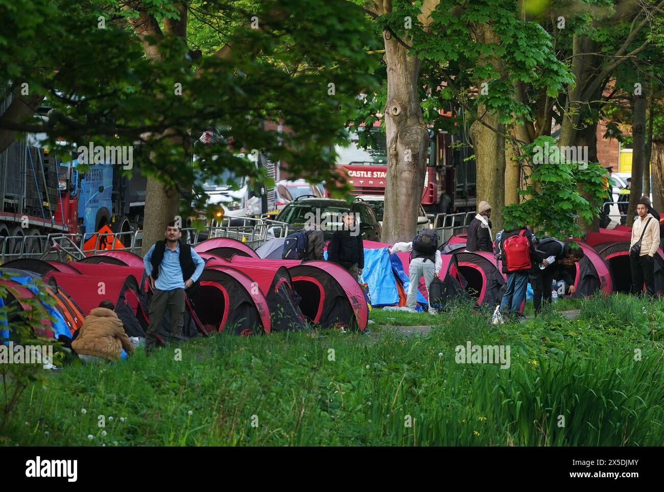 An early morning operation to remove tents which have been pitched by asylum seekers along a stretch of the Grand Canal, Dublin. The asylum claimants moved into the area after another makeshift migrant camp surrounding the International Protection Office (IPO) on Mount Street, Dublin, was dismantled in multi-agency operation last week. Picture date: Thursday May 9, 2024. Stock Photo
