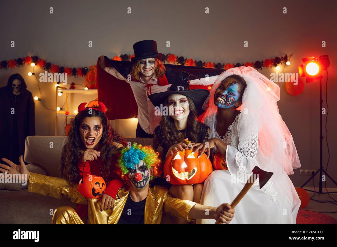 Portrait of smiling dressed people celebrate Halloween Stock Photo