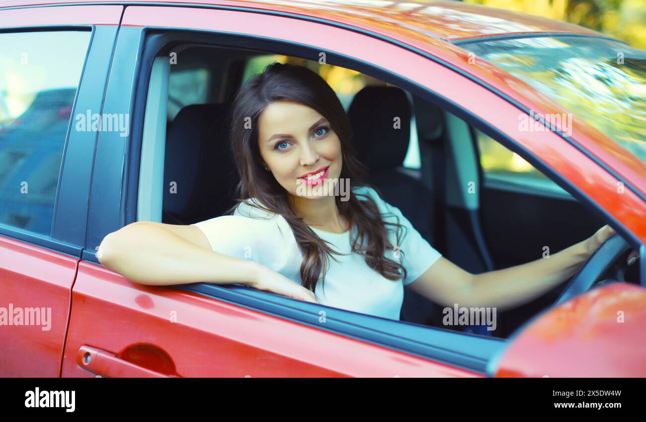 Woman sitting behind steering wheel hi-res stock photography and images ...