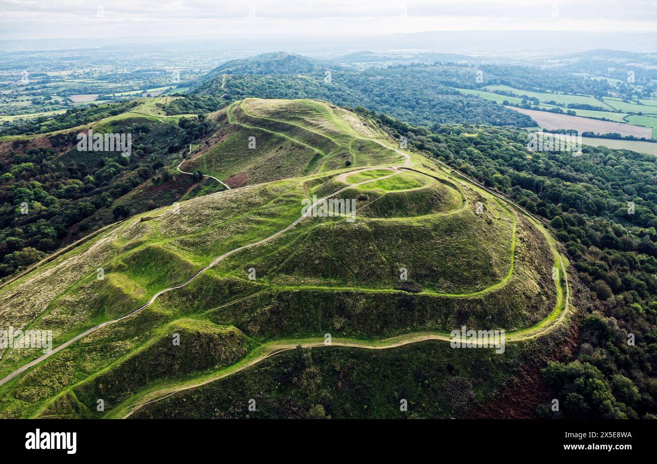 Contour earthworks of Iron Age hillfort known as British Camp aka Herefordshire Beacon dates from approx. 2nd C. BC. Aerial looking SW. Malvern Hills Stock Photo