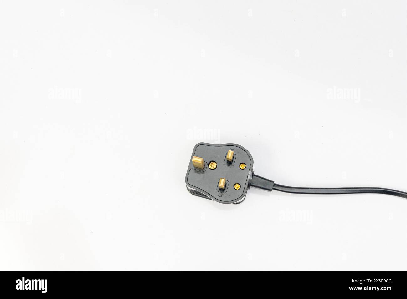 Three pin electric plug isolated on the white background Stock Photo