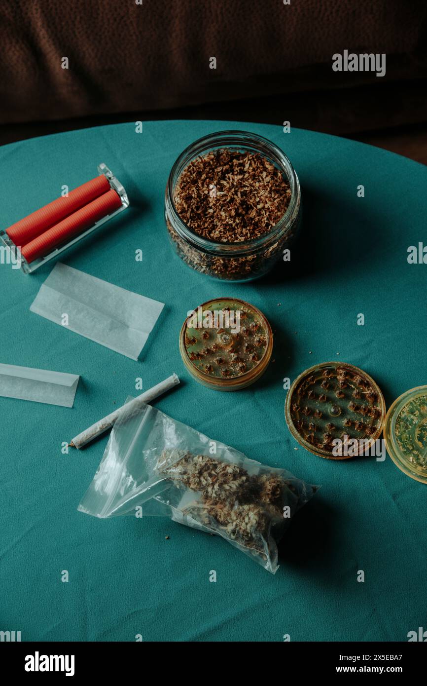 some cannabis buds in a plastic bag on a table next to a used herb