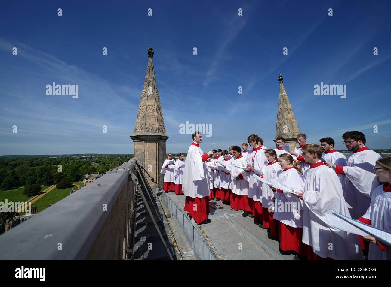The Choir of St John's College, Cambridge perform the Ascension Day carol from the top of the Chapel Tower at St John's College at the University of Cambridge. Picture date: Thursday May 9, 2024. Stock Photo