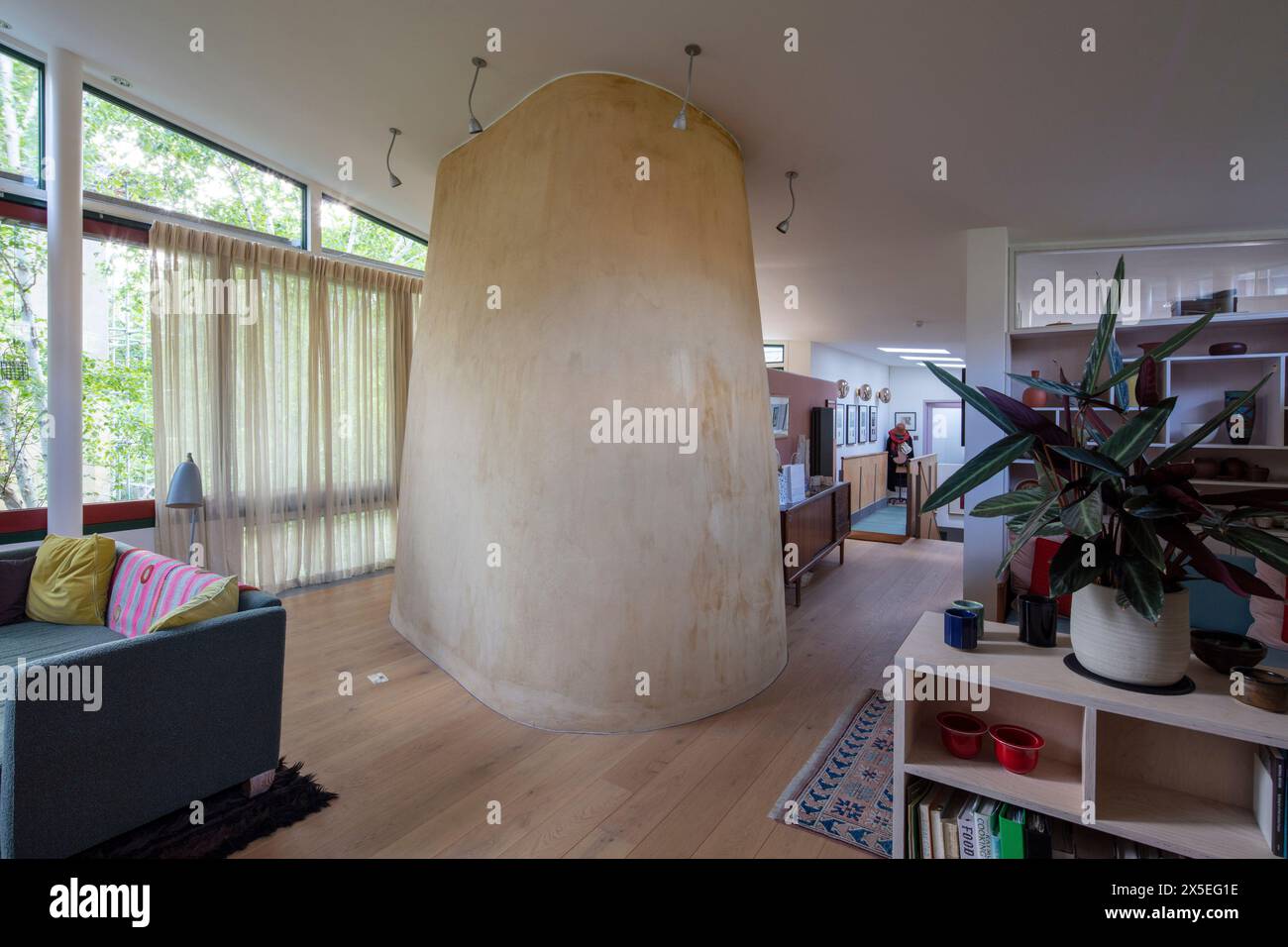 Living room looking towards the kitchen space. Straw Bale House