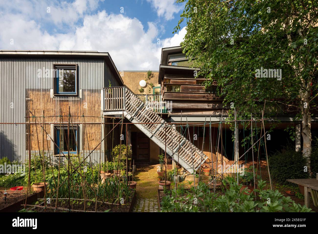 Corrugated plastic wraps around the straw bales to create part of the