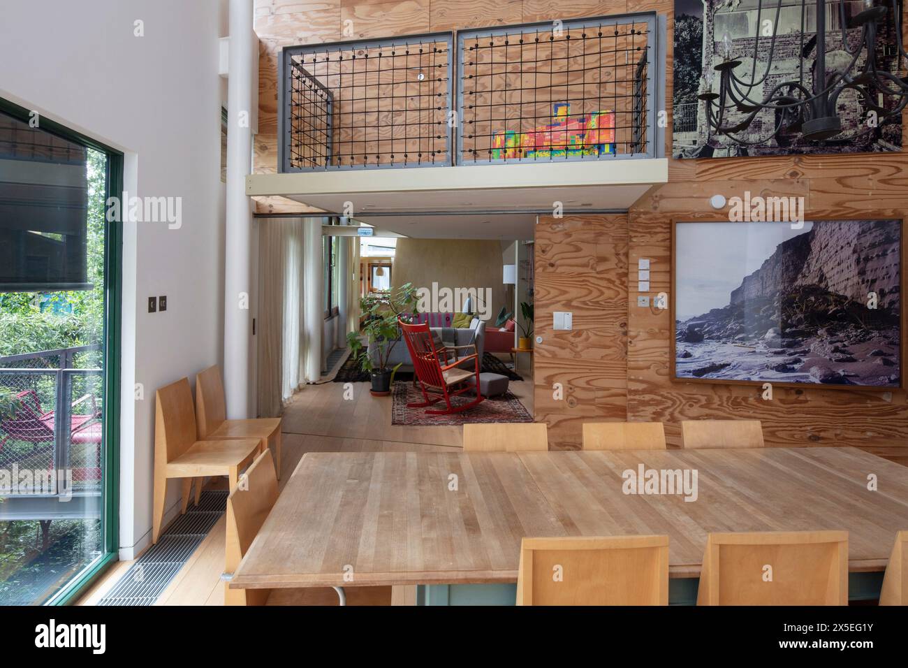 Looking across the dining room towards the living room. Straw Bale