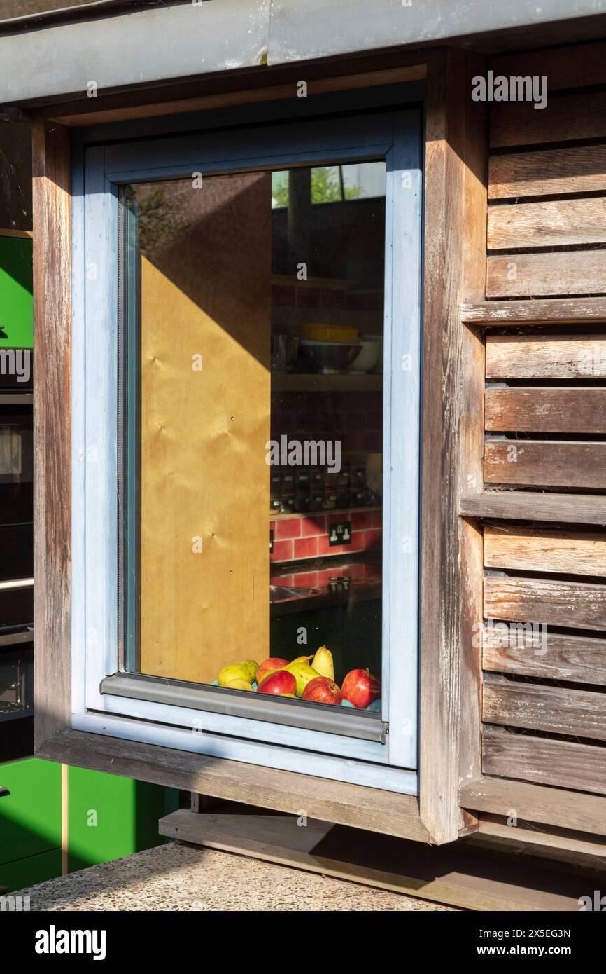 Exterior view looking in to the kitchen from the exterior balcony