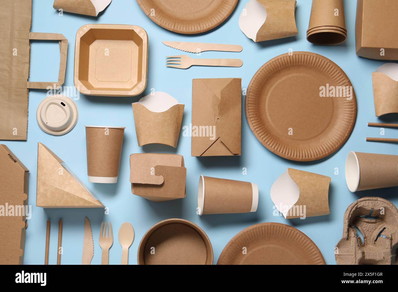 Flat lay composition with eco friendly food packagings on light blue ...