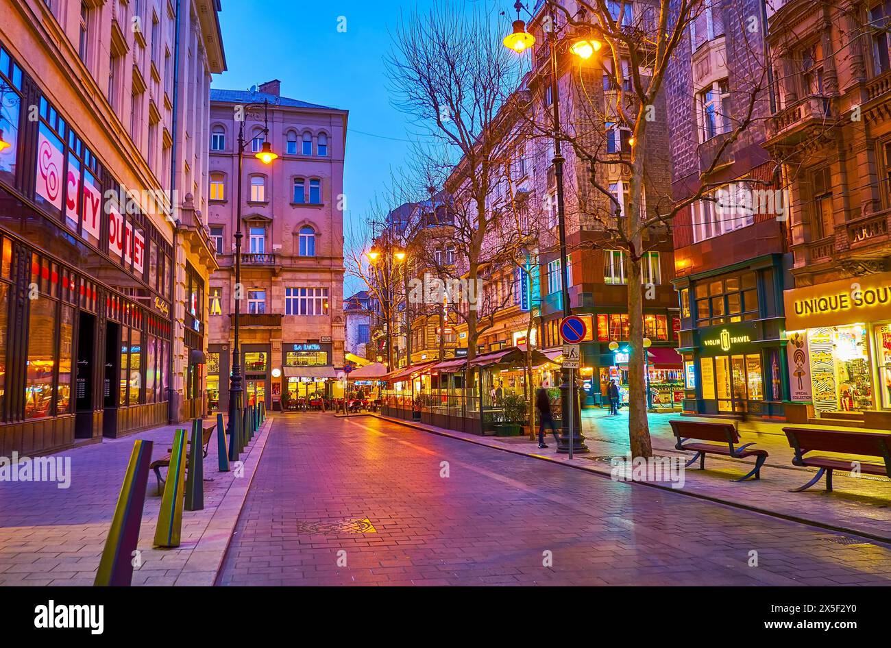 BUDAPEST, HUNGARY - MARCH 3, 2022: The famous tourist Vaci Street in bright evening lights, Budapest, Hungary Stock Photo