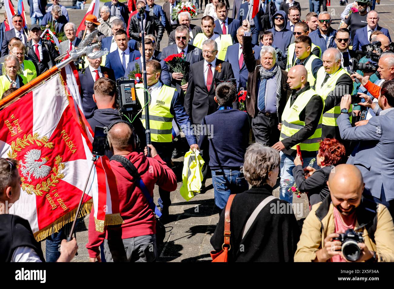 Russians ambassador to Poland, Sergey Andreyev arrives to lay flowers at the Mausoleum of the Soviet Soldiers Cemetery on Russian Victory Day, May 9, 2024 in Warsaw, Poland. High security was present with the Russian Ambassador. Ukrainian protesters demonstrated as Russian ambassador arrived. Stock Photo