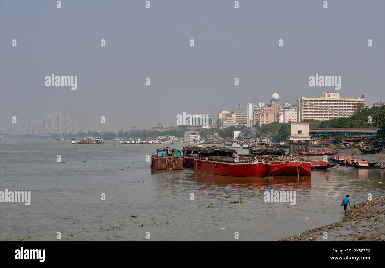 Calcutta riverscape with Howrah Bridge in the background Stock Photo