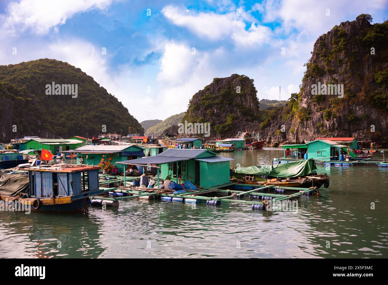 Floating village in sea bay in Vietnam Stock Photo - Alamy