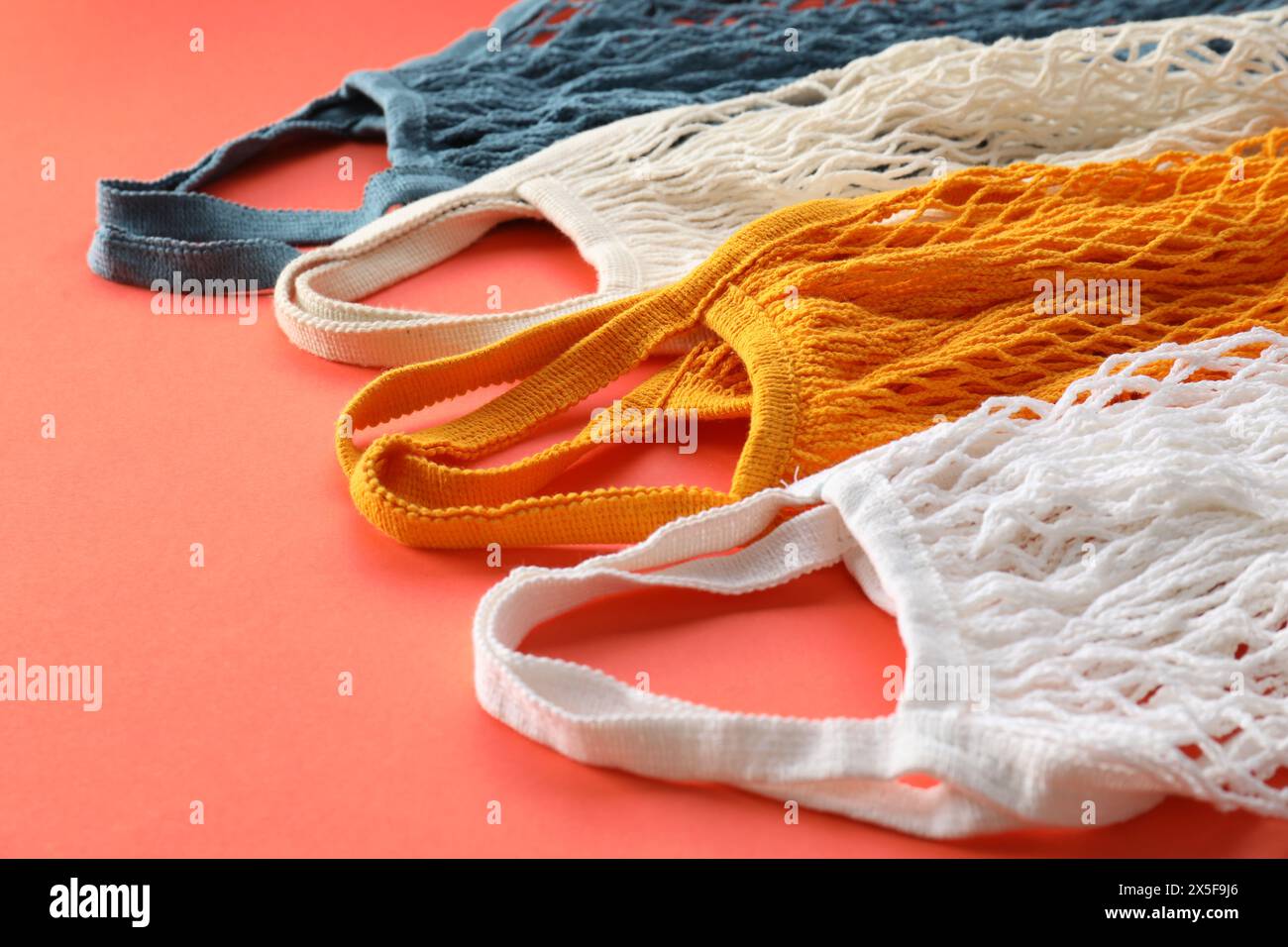 Different string bags on red background, closeup Stock Photo Alamy