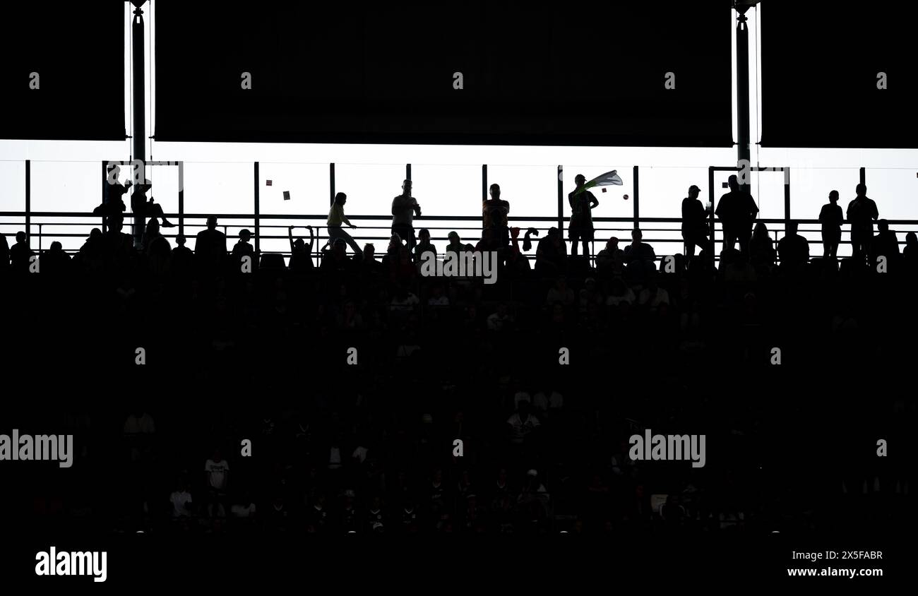 Cologne, Germany. 09th May, 2024. Soccer, Women: DFB Cup, VfL Wolfsburg - Bayern Munich, final, RheinEnergieStadion. Fans stand in the stadium. Credit: Fabian Strauch/dpa - IMPORTANT NOTE: In accordance with the regulations of the DFL German Football League and the DFB German Football Association, it is prohibited to utilize or have utilized photographs taken in the stadium and/or of the match in the form of sequential images and/or video-like photo series./dpa/Alamy Live News Stock Photo