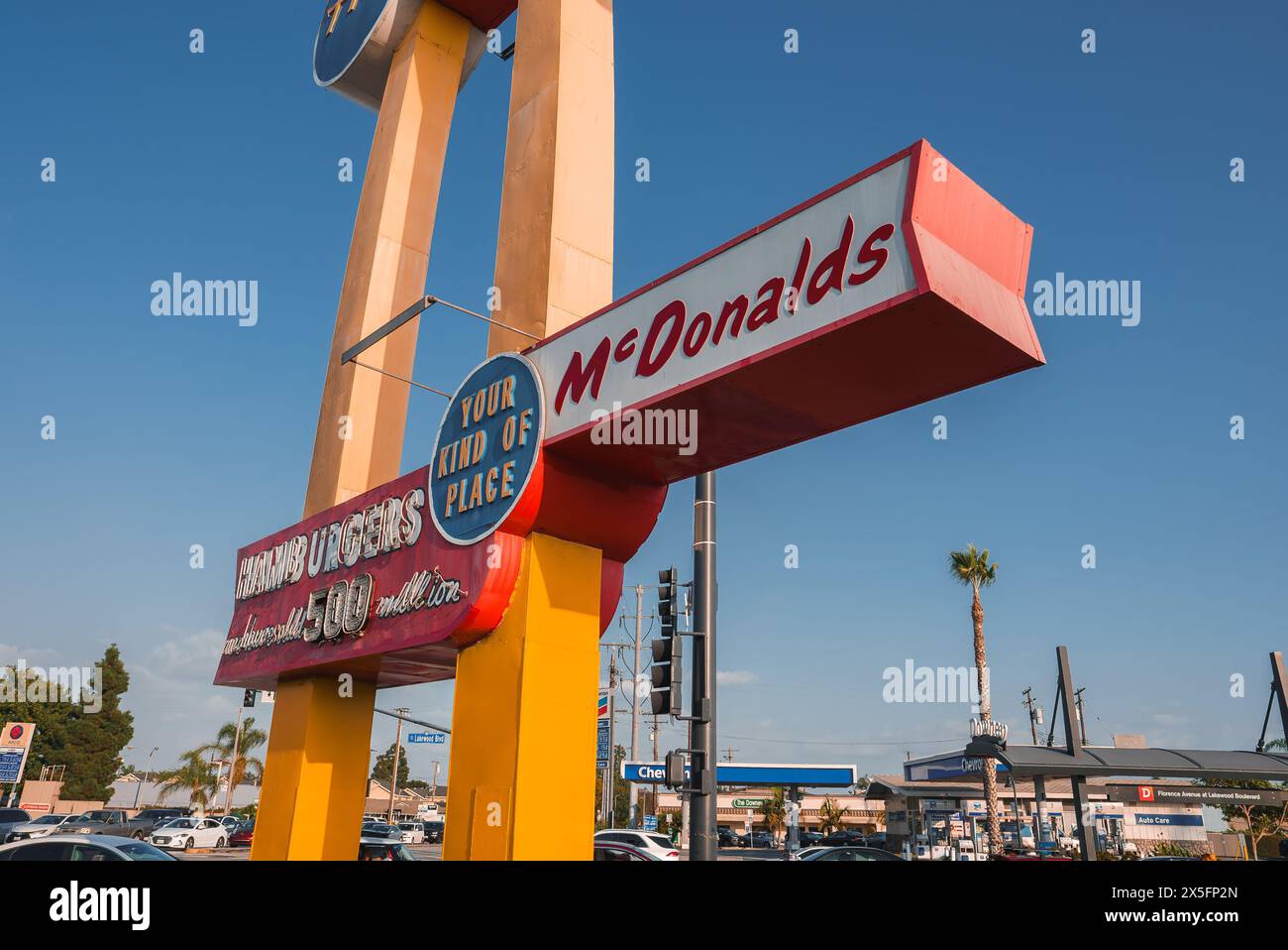 Classic McDonald's Sign Against Clear Blue Sky, Busy Commercial Area ...