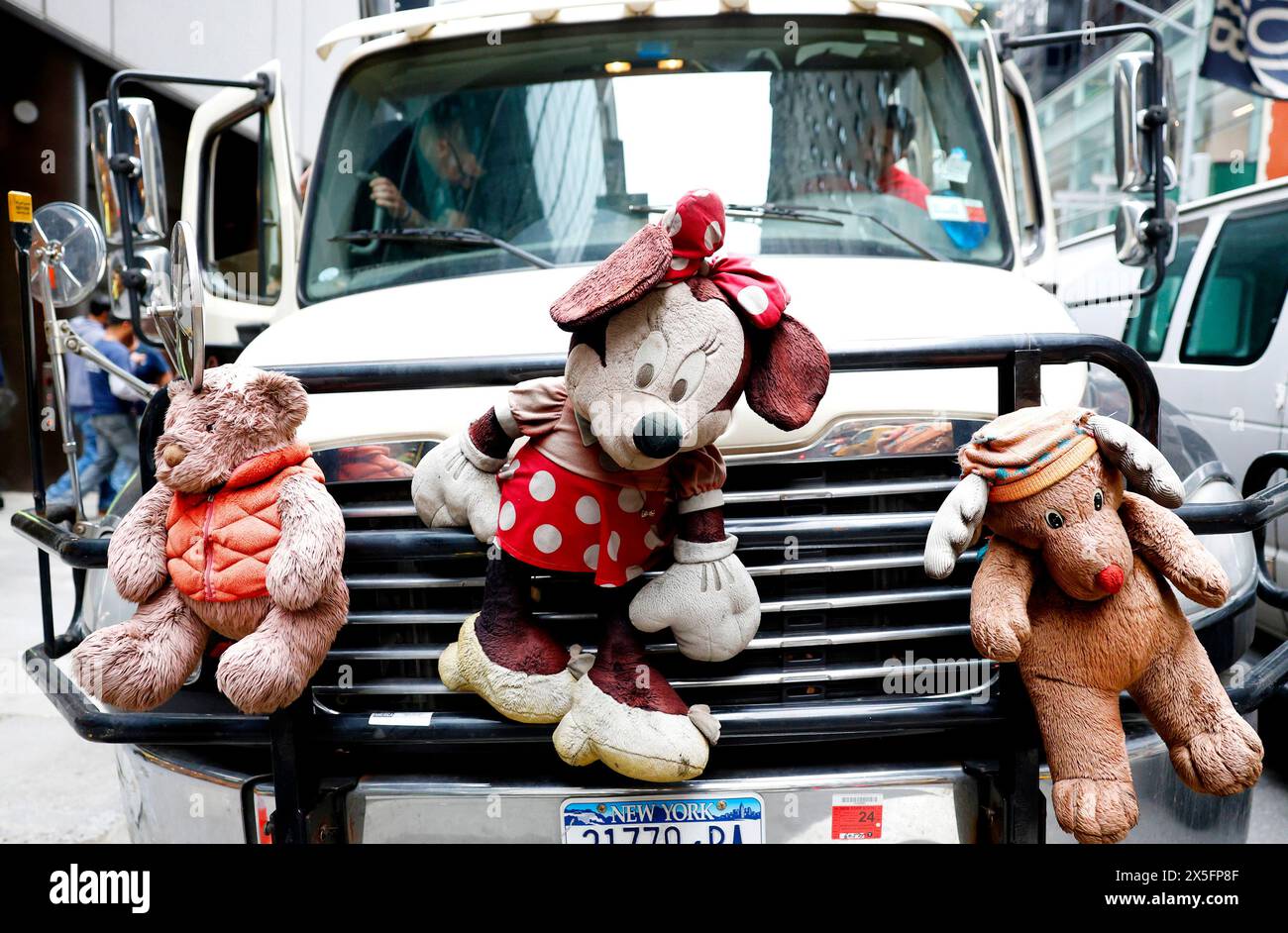 New York, United States. 09th May, 2024. Minnie Mouse and other stuffed animals hang from the grill of a truck near Fifth Avenue in New York City on Thursday May 9, 2024. Photo by John Angelillo/UPI Credit: UPI/Alamy Live News Stock Photo