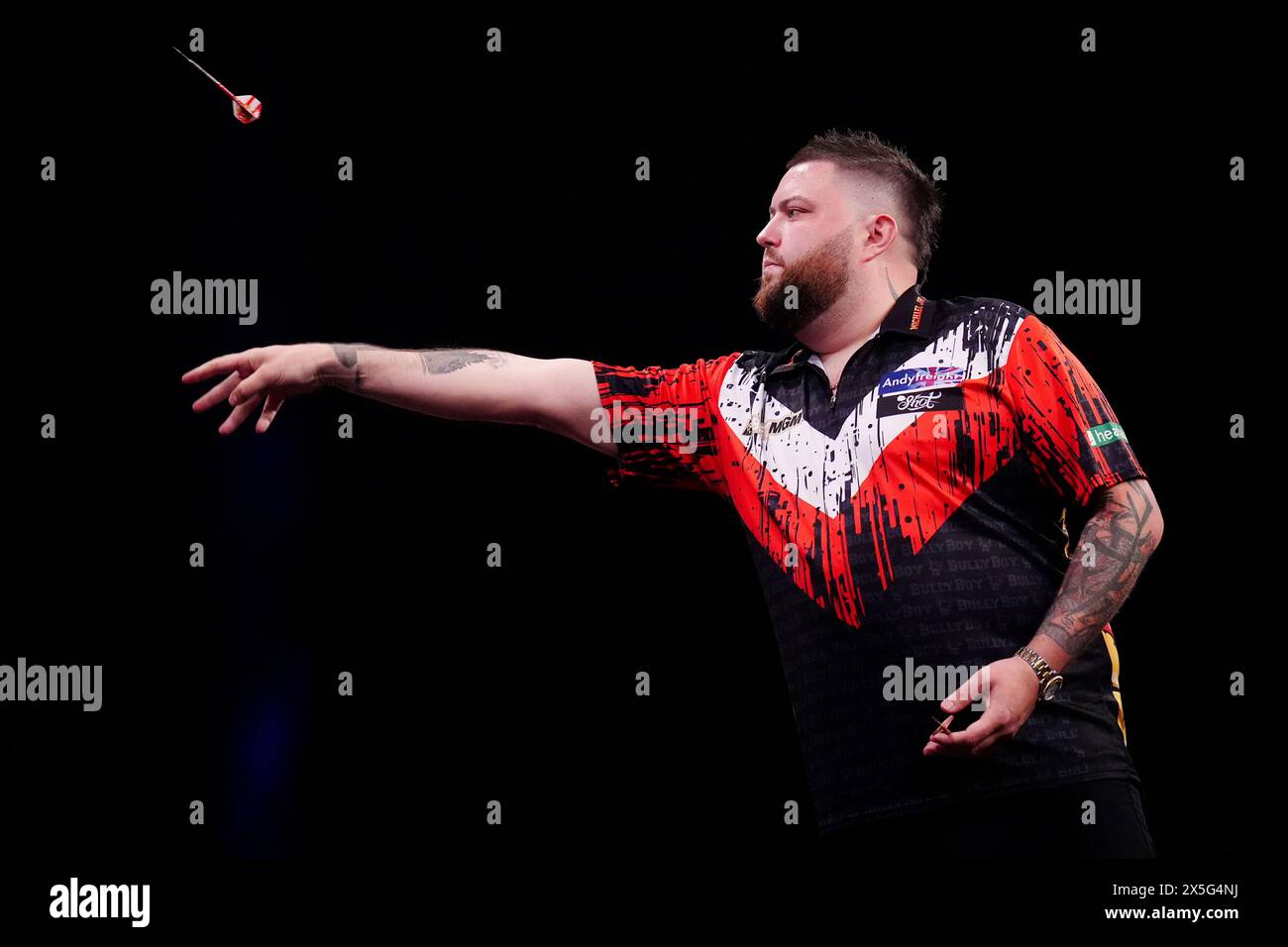 Michael Smith in action against Nathan Aspinall(not pictured) during night fifteen of the BetMGM Premier League held at the First Direct Arena, Leeds. Picture date: Thursday May 9, 2024. Stock Photo
