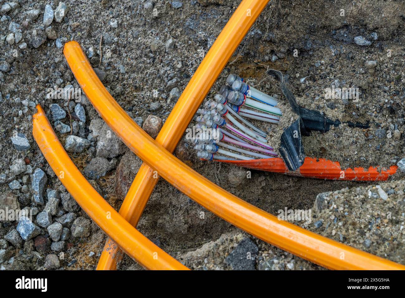 Laying of fiber optic cables, empty conduits are laid under a sidewalk