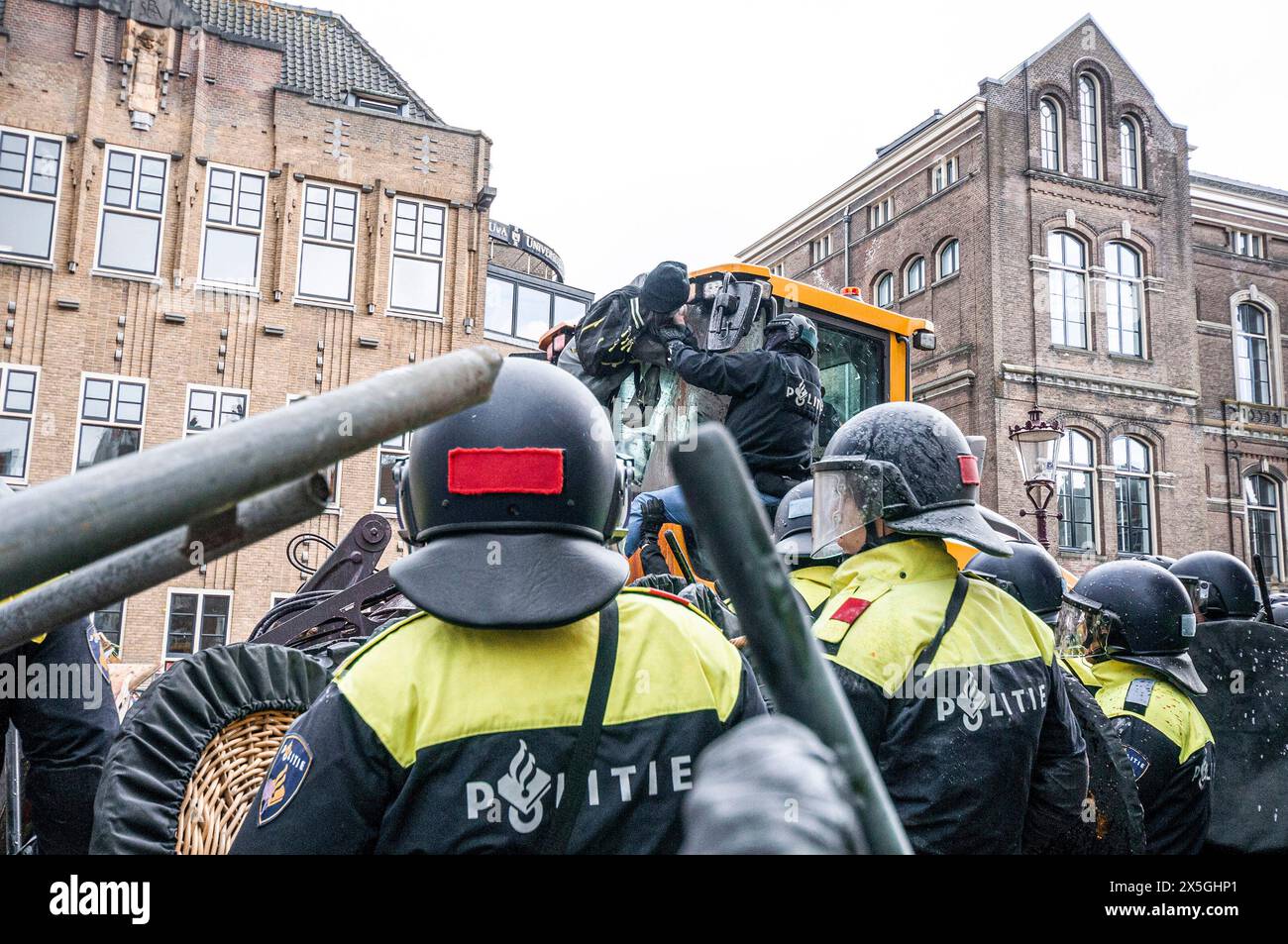 Piersonstraat Riots Police arrest a student on bulldozer used to dismantle barricades ...