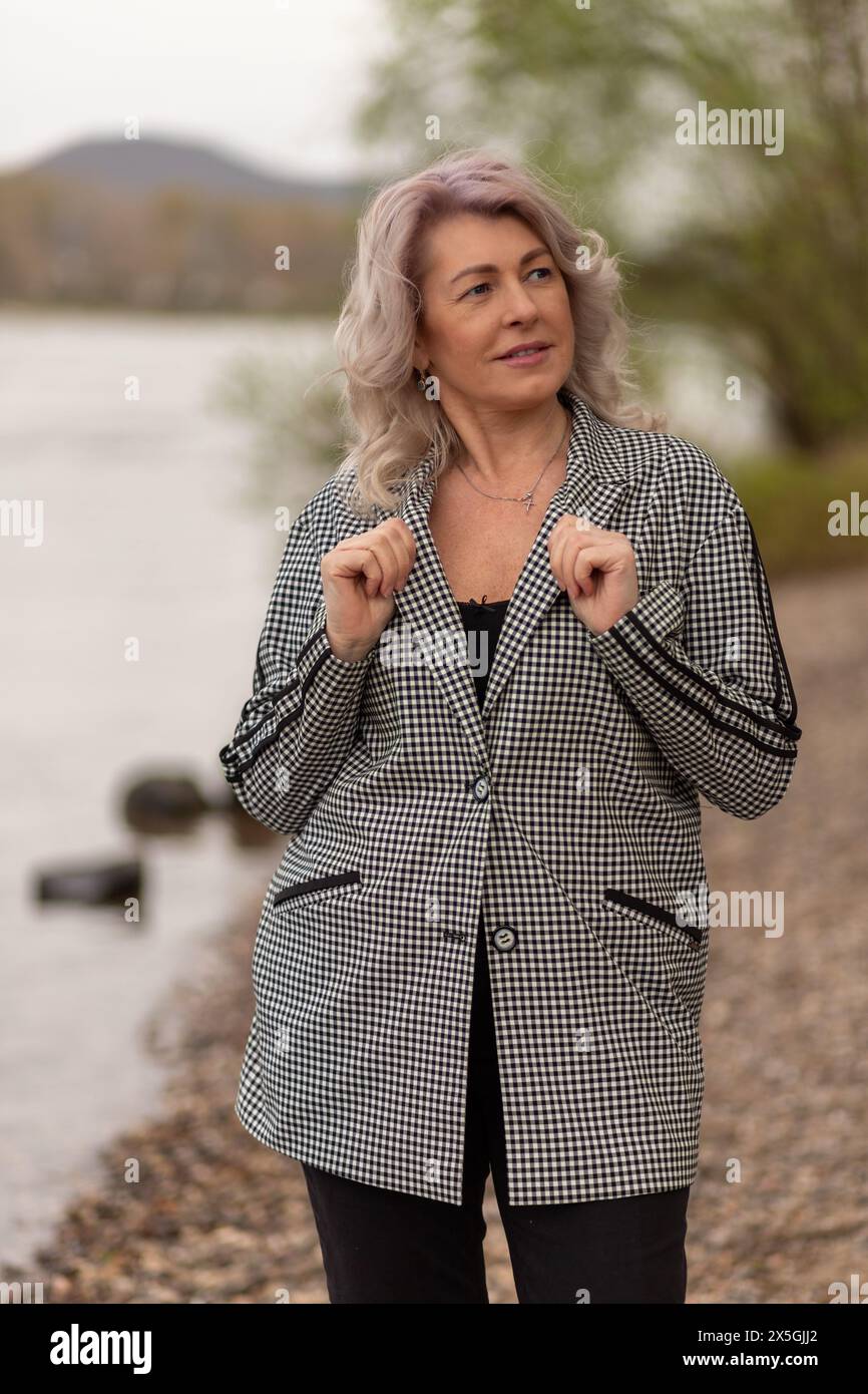 Poised mature woman in hi-res stock photography and images - Alamy