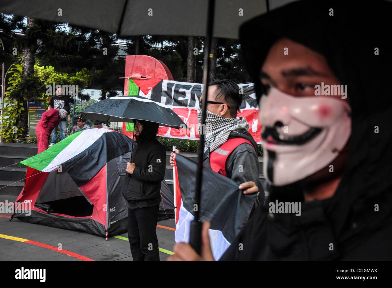 May 9, 2024, Bandung, West Java, Indonesia: A number of masses who joined the Kamisan Action unfurled Palestinian flags, demand banners, and set up tents during the Kamisan Bandung action entitled All Eyes on Rafah at Taman Dago Cikapayang. The Kamisan Action, which is held every Thursday to fight all forms of human rights violations in Indonesia, is holding a solidarity action for Palestine, which is the target of genocide carried out by Israel which has killed more than thirty thousand people since October 2023. (Credit Image: © Dimas Rachmatsyah/Pacific Press via ZUMA Press Wire) EDITORIAL Stock Photo