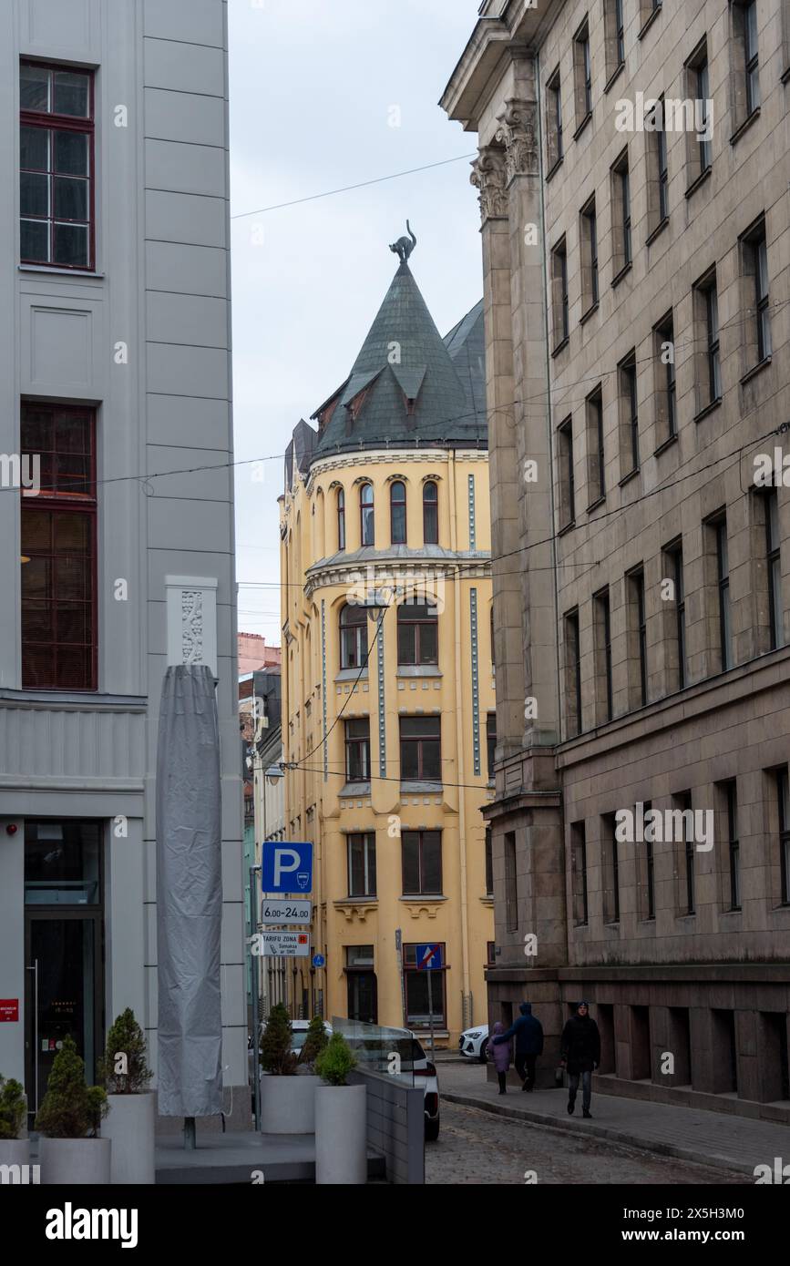 Cat house, pose of the cat shows displeasure of the owner about the refusal of membership in the Great Guild, Riga, Latvia Stock Photo