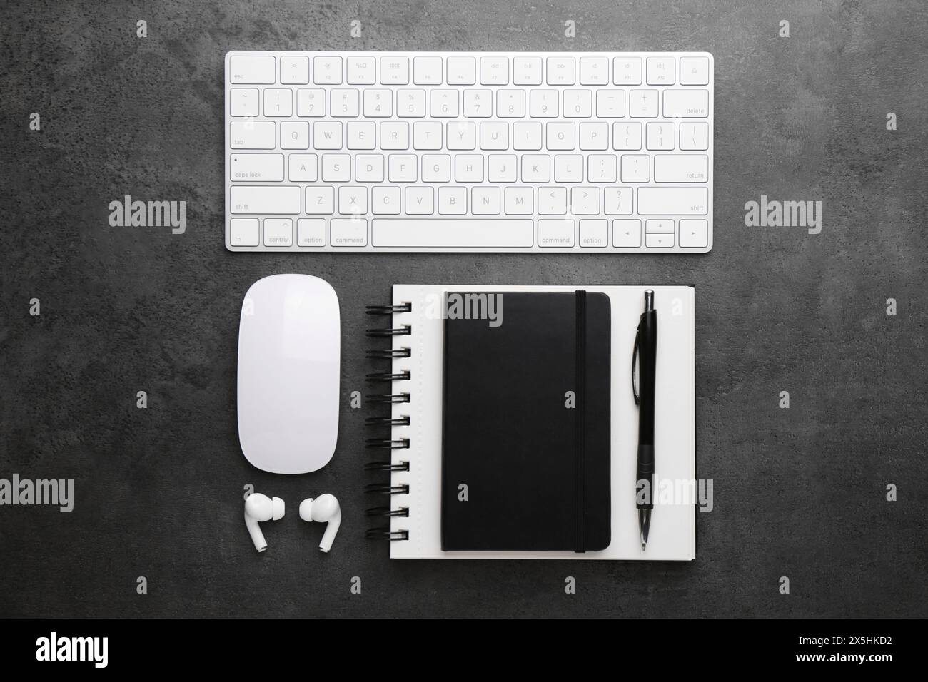 Flat lay composition with different office stationery on dark grey ...