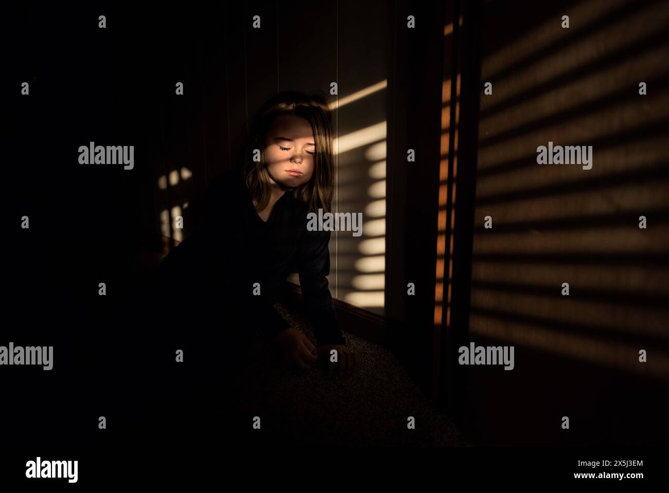 Beautiful girl resting in sun and shadows Stock Photo
