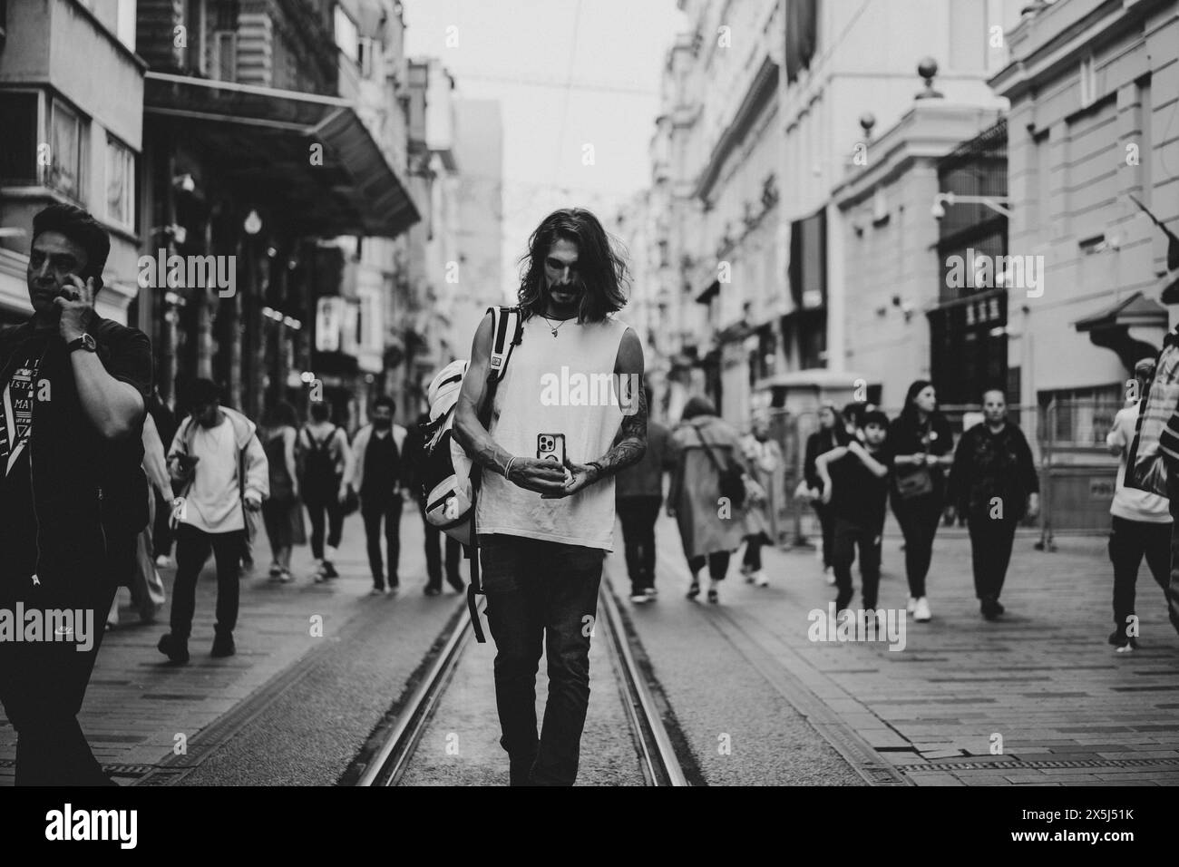 Man tourist walks in Istanbul, fooling around, taking photos. Stock Photo