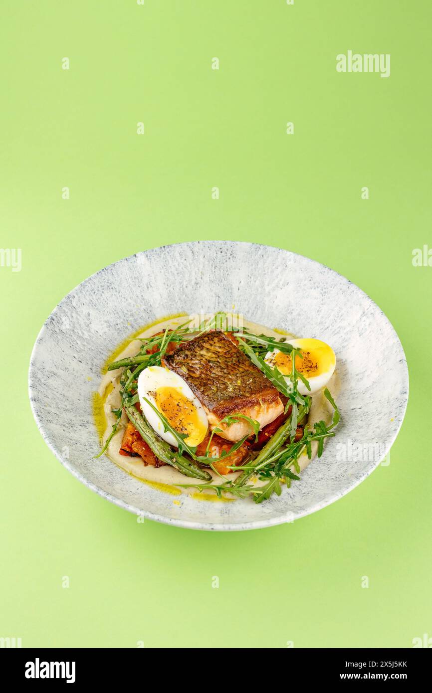 fried fish in a side dish on a plate Stock Photo